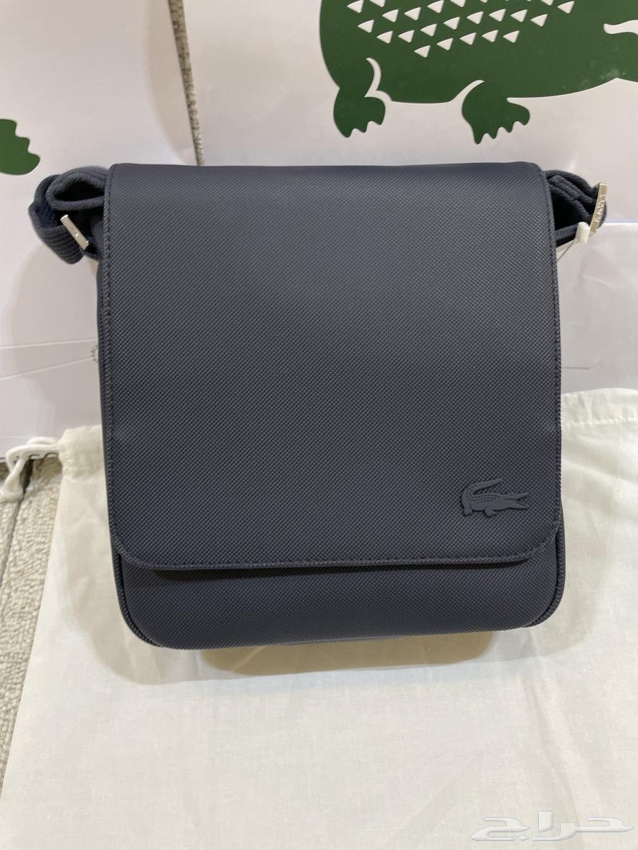 شنطة لاكوست اصلية جديدة مع كيس الوكيل64467536069122110