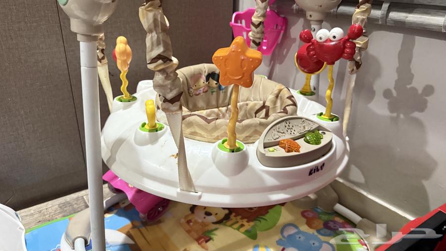 Clean bed and a baby chair shaped like a stroller, clean64468092884226111