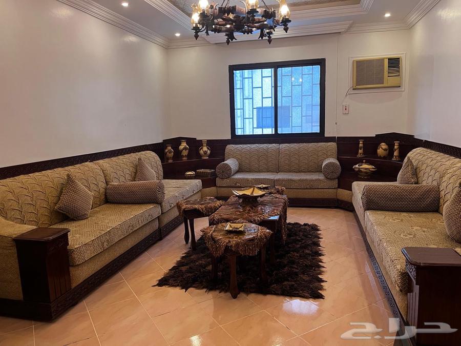 Moroccan sofa set with paintings, side tables, and decorative items for sale64482768927234110