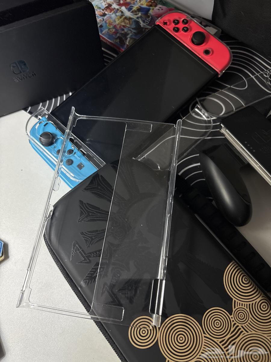 Used OLED Switch with two games64483437872770112