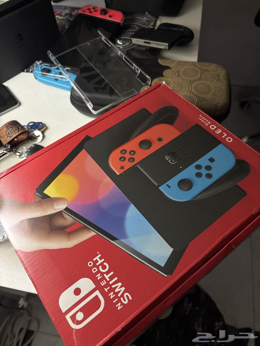 Used OLED Switch with two games64483437872770113