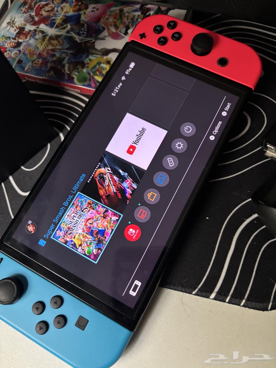 Used OLED Switch with two games64483437872770110