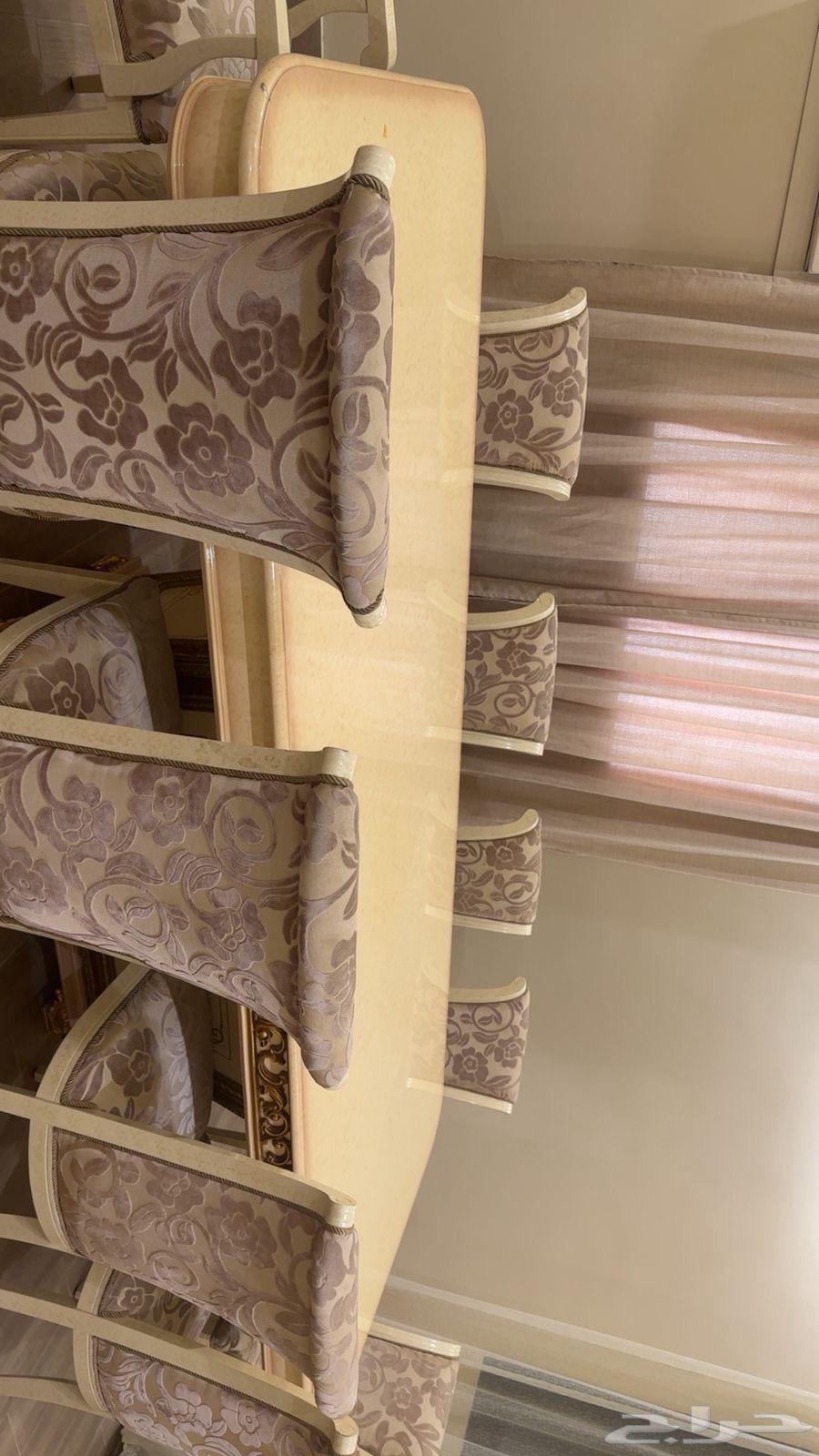 Clean dining table with 10 chairs64482390371458113