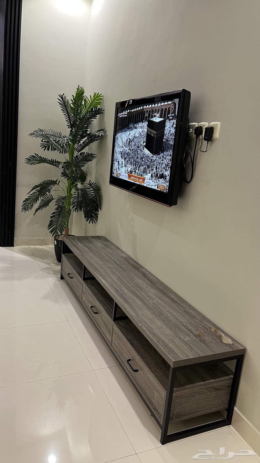 Sofa for sale with carpet, tables, and TV table64491225324035113