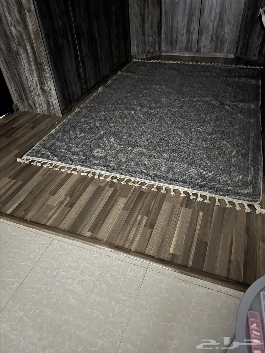Gray-colored almost new jute rug, approximately 3 by 3.564494304790530110