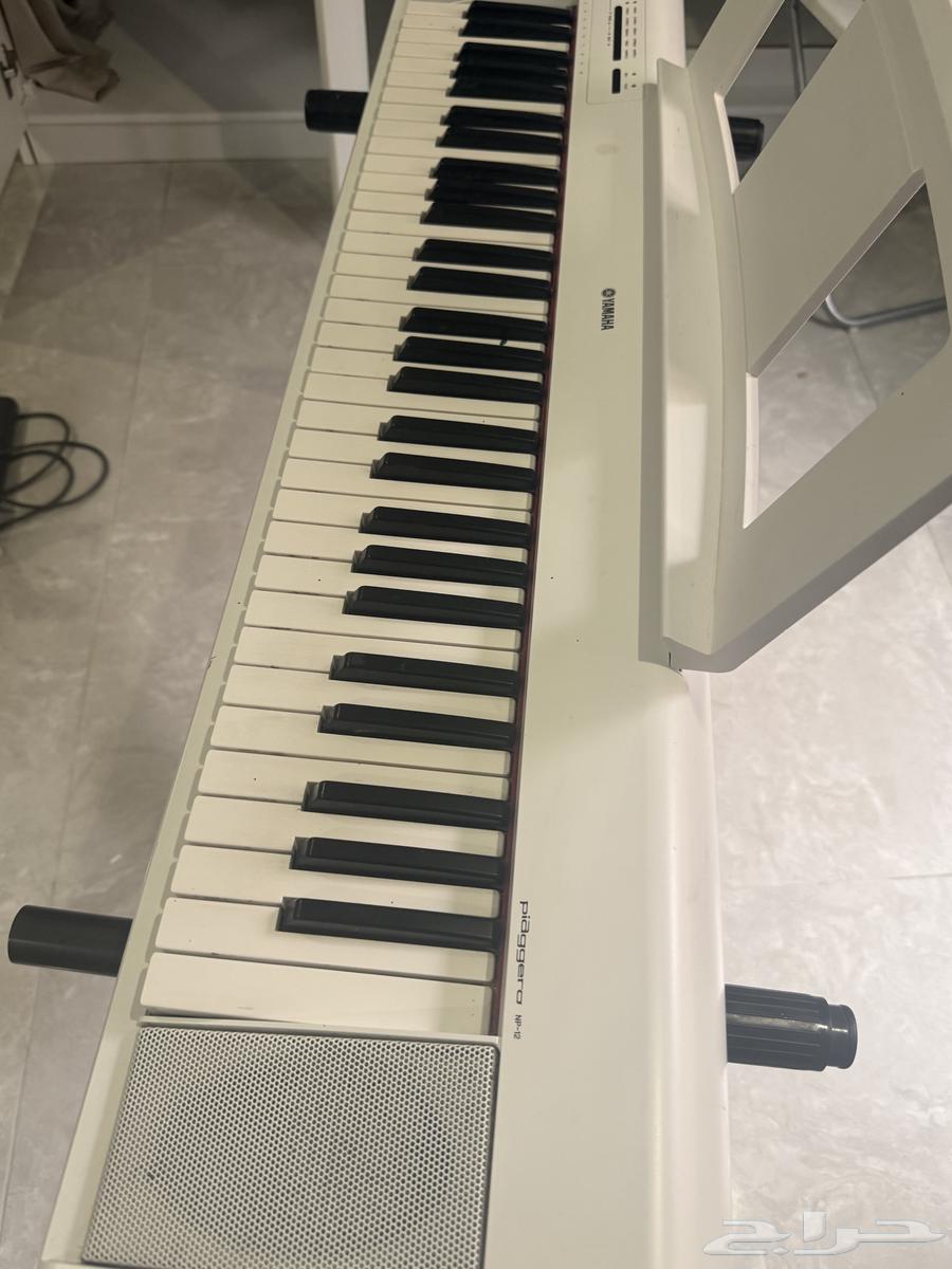 بيانو ابيض64490890299649114