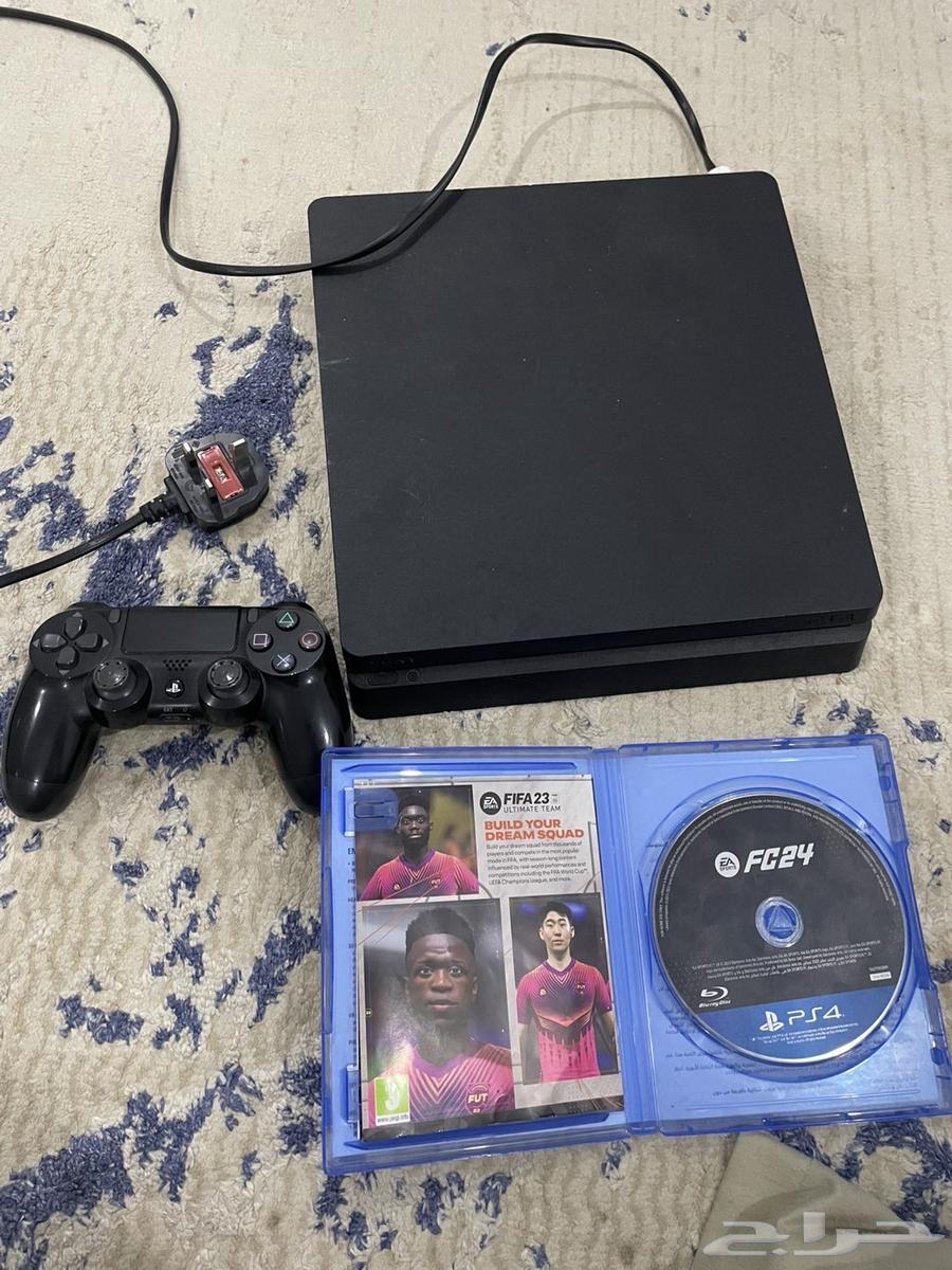 PlayStation 4 with controller and FC24 tape, minor damage at cable port64502336816769111