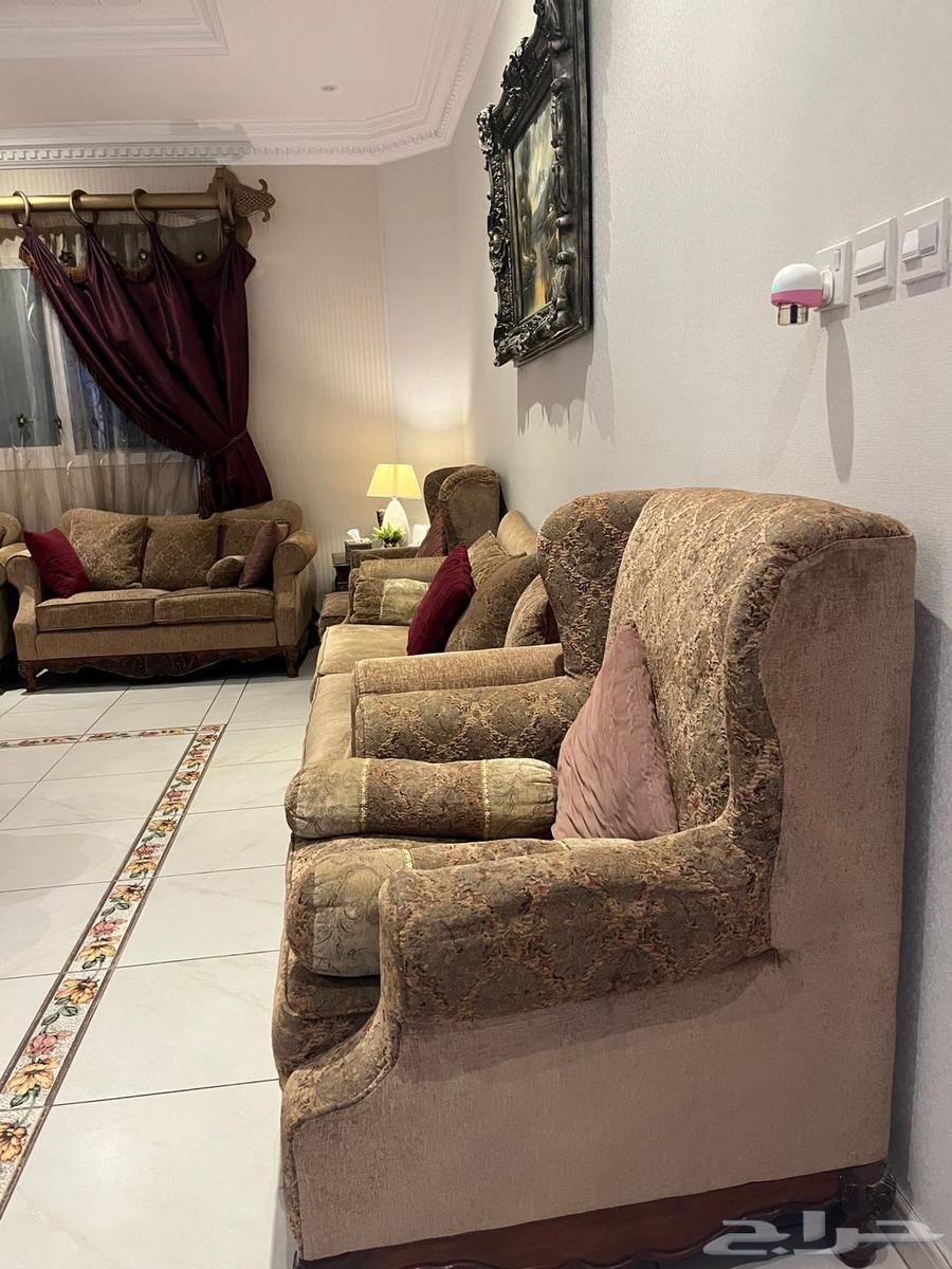 American sofa for sale with curtains, two tables, and an art painting64502336876547110
