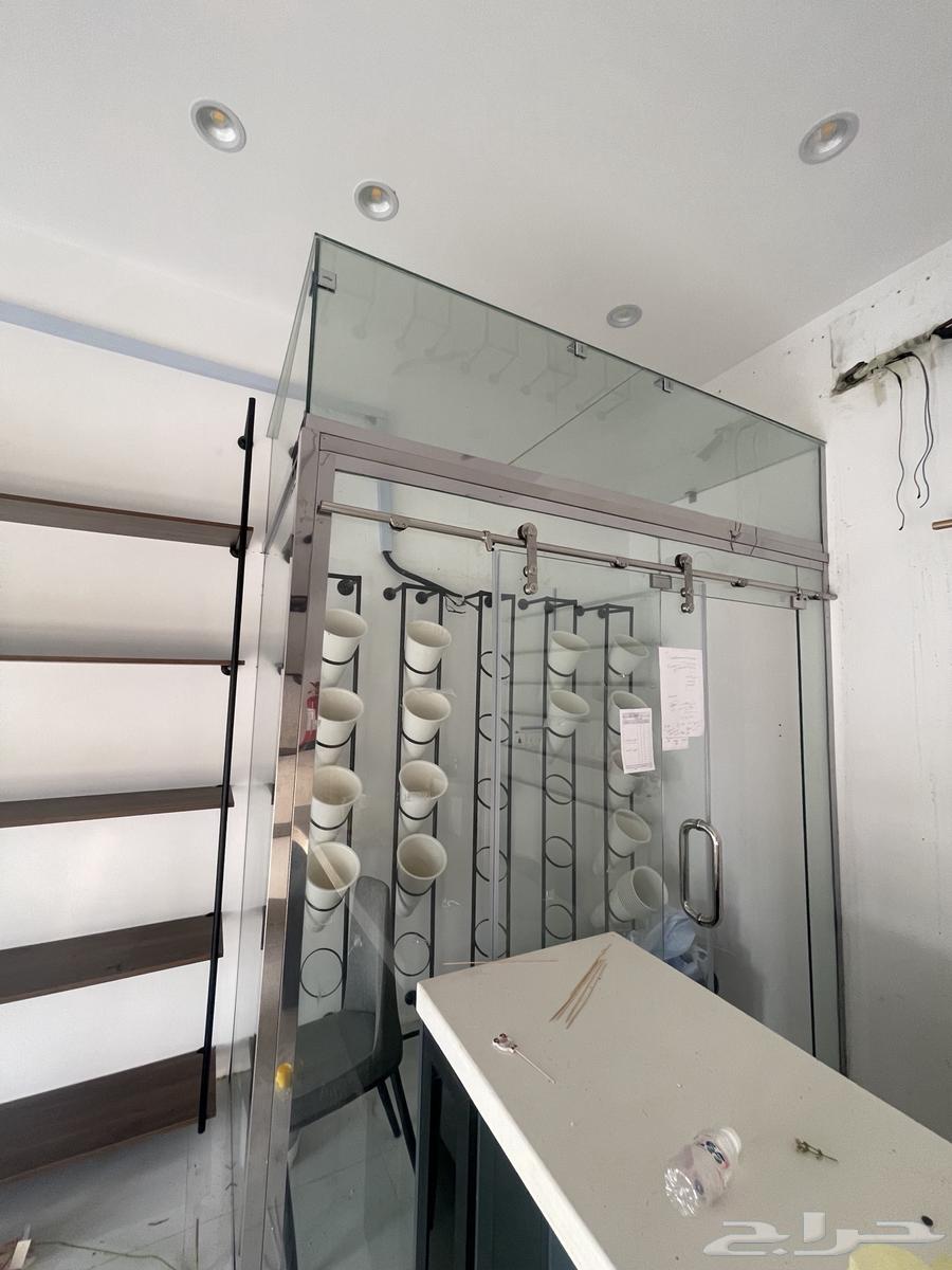 For sale shop door with refrigerator, display case, chairs and table64500923272321110