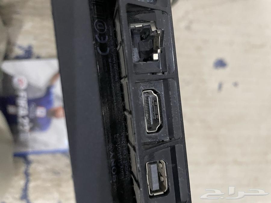 PlayStation 4 with controller and FC24 tape, minor damage at cable port64502336816769110