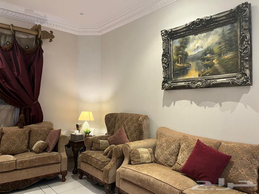 American sofa for sale with curtains, two tables, and an art painting64502336876547114