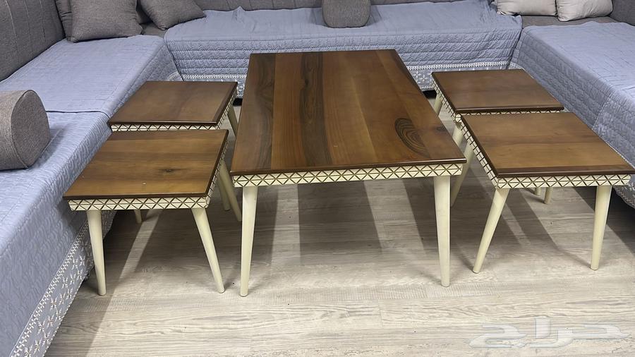 A large table and four side tables64502268479107111