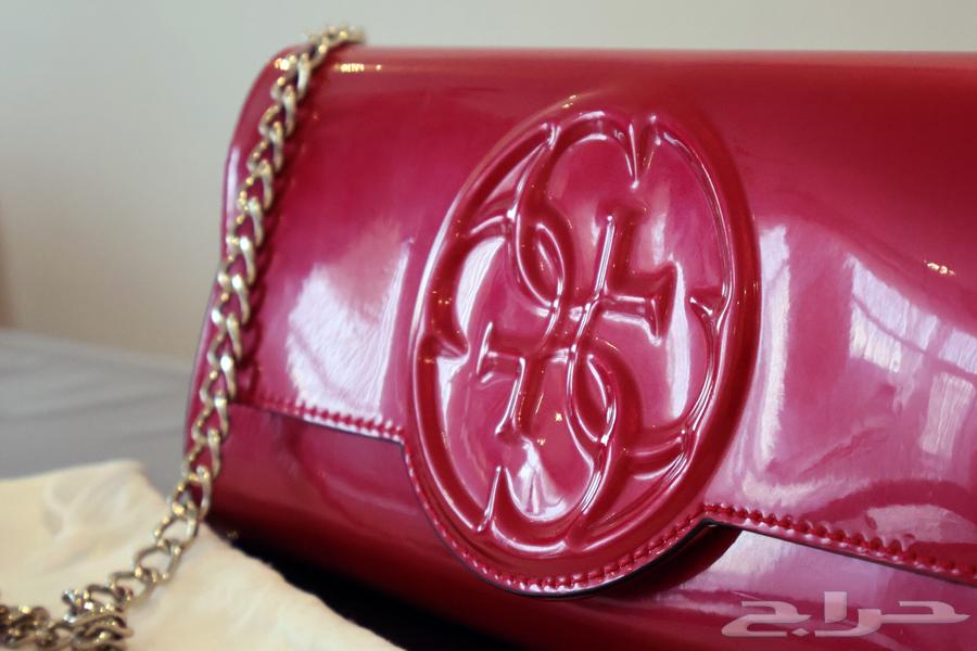 Guess Korry Patent Crossbody Clutch Bagشنطة64497827667075110