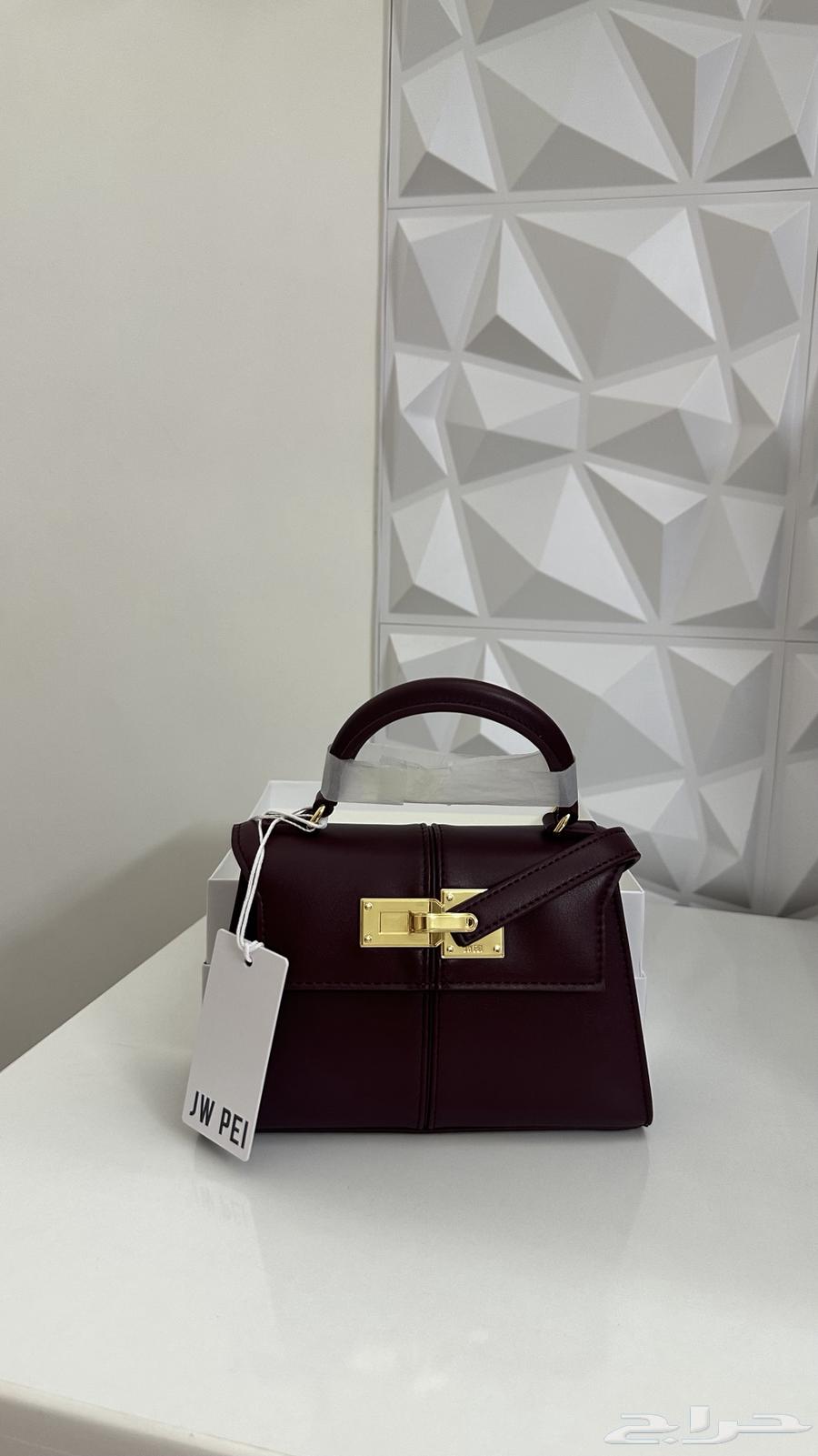 شنطة جديده من ماركة جوي بي لون ( برغندي ) حجم (ميني )64510154204802110