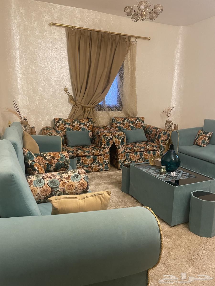 He has a new and clean sofa with the side tables64515877743363112