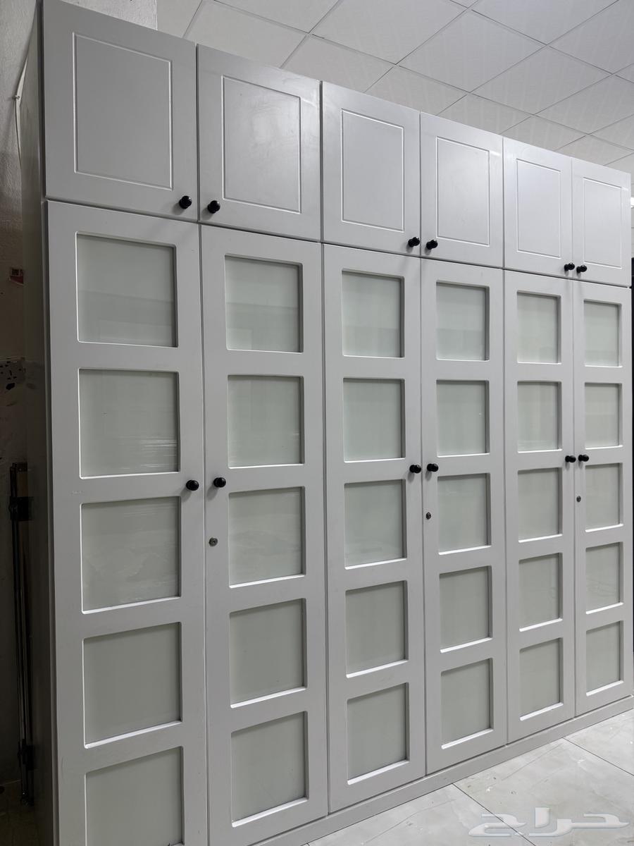 Clothes closets in a bedroom with a single bed, used and clean64527348141057110