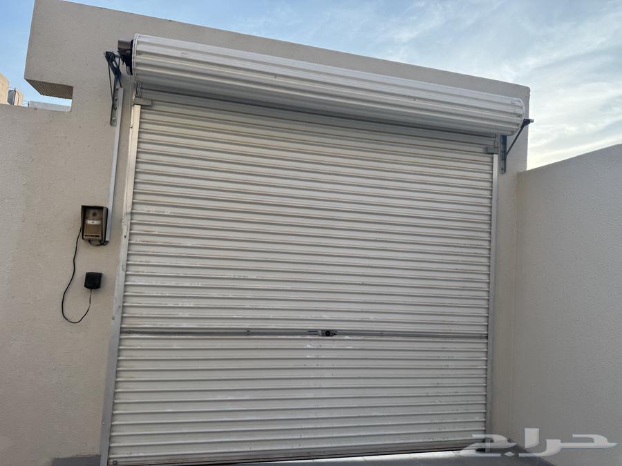 New garage door with remote, by God it has not been used, brand new, God knows64527404180097110