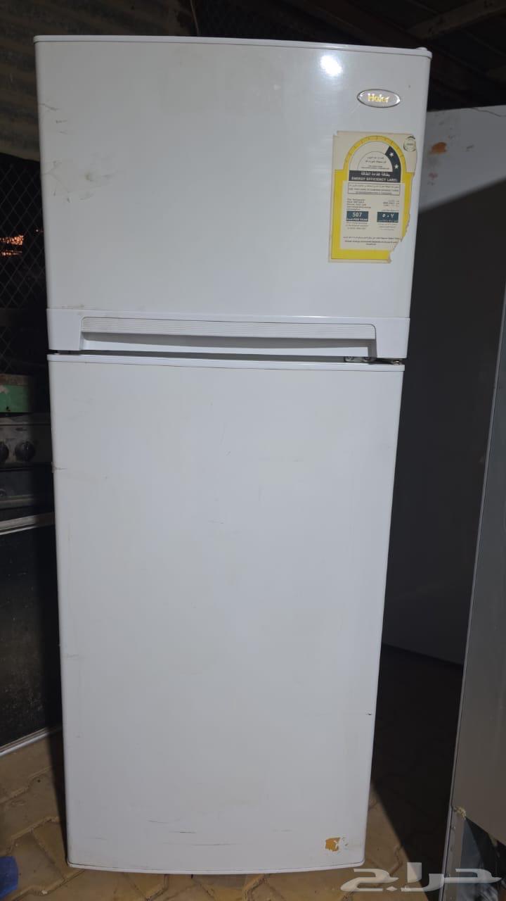 Three refrigerators with specifications on display64532719595265110