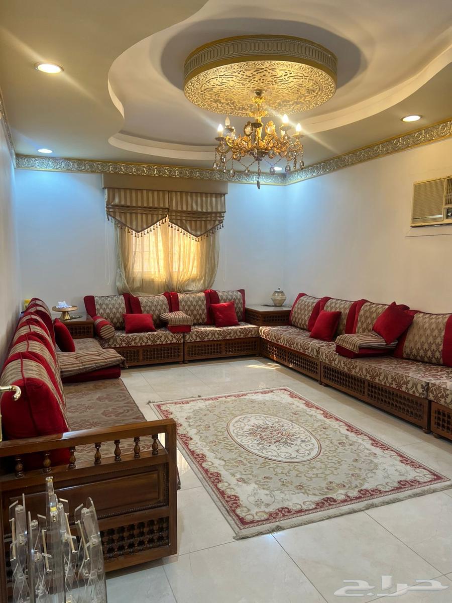 A complete Moroccan living room set with sofa, curtains, rug, and service tables64539158853377110