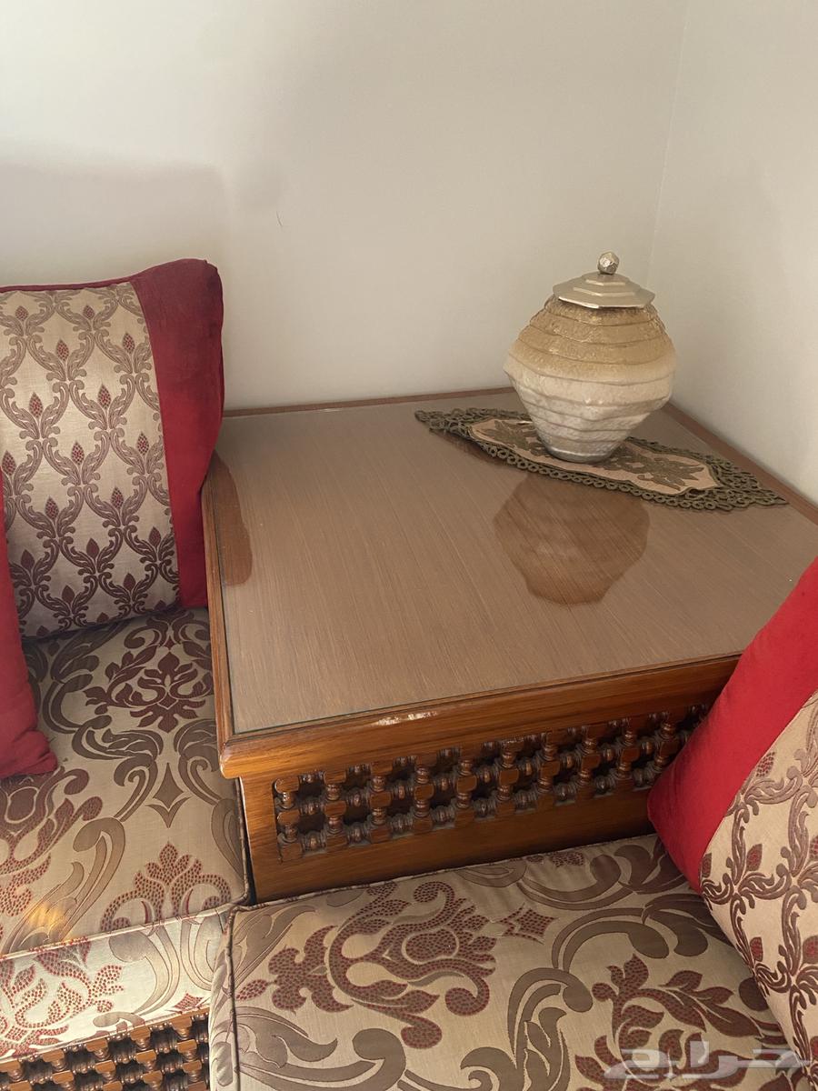 A complete Moroccan living room set with sofa, curtains, rug, and service tables64539158853377114