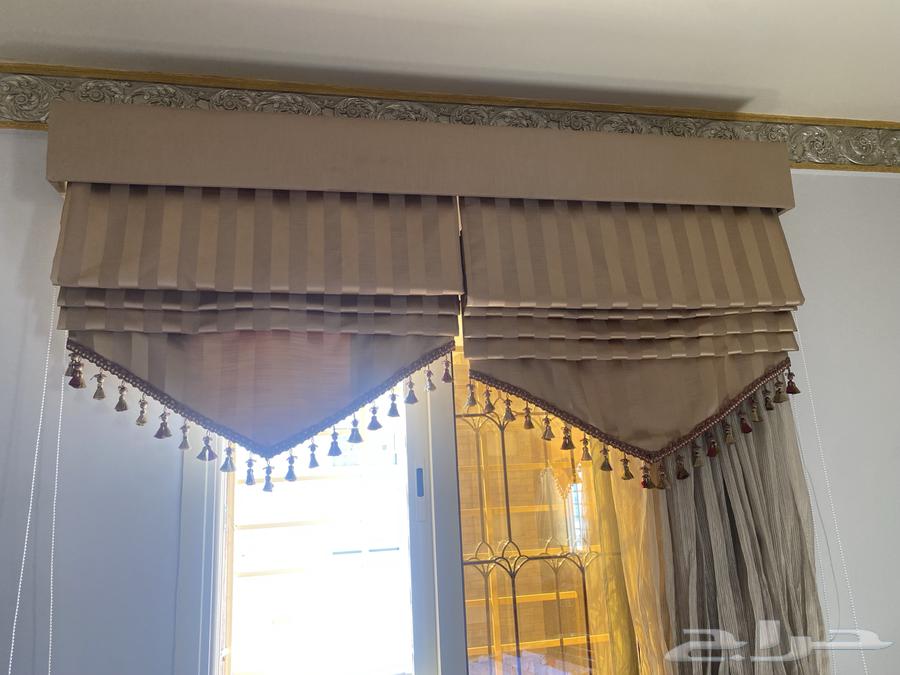 A complete Moroccan living room set with sofa, curtains, rug, and service tables64539158853377112