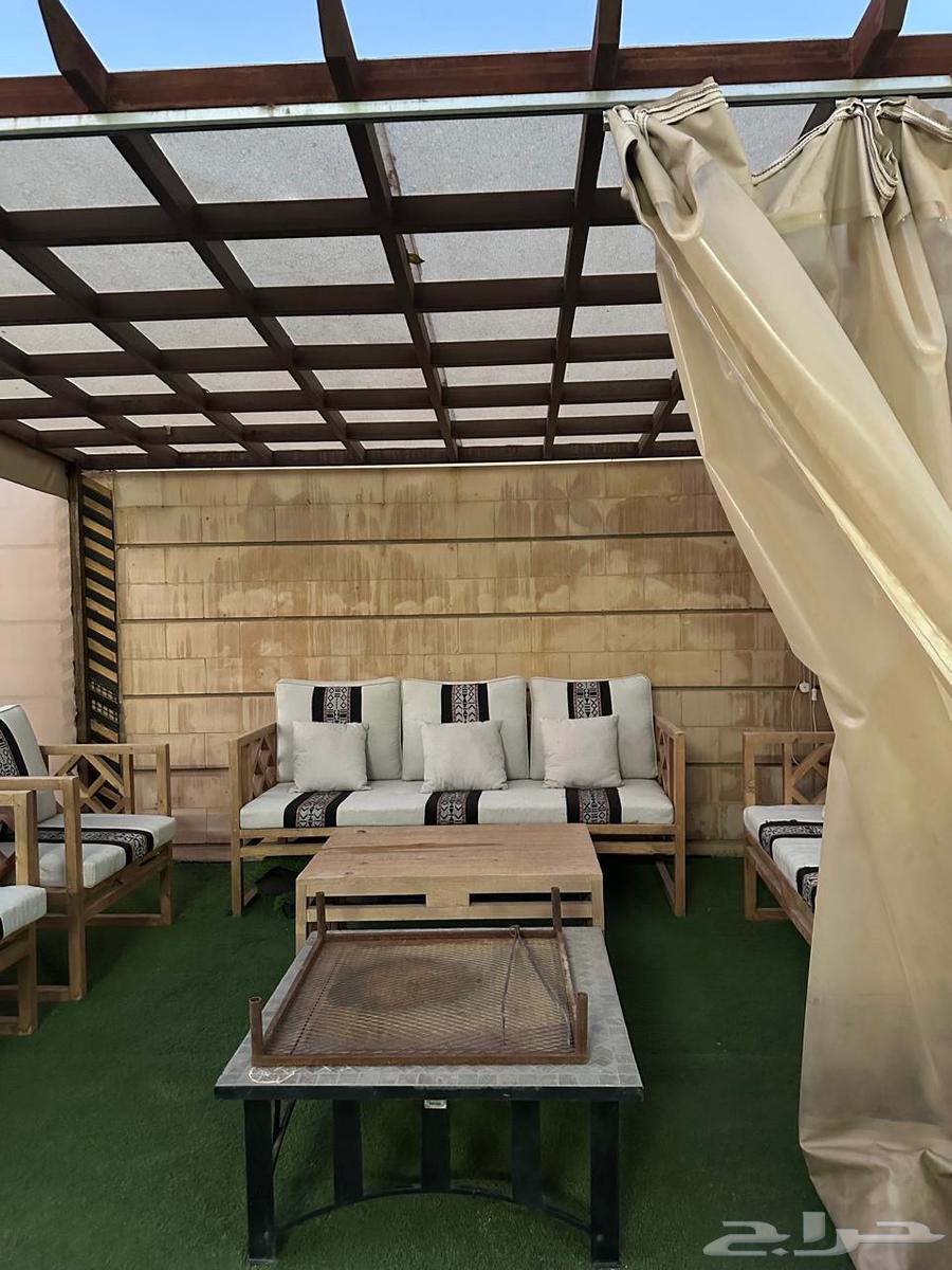 Outdoor seating set with umbrella, table, and grill64585380704898111