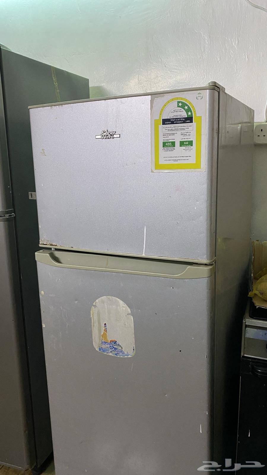 Three-eye gas stove and a refrigerator in good condition and both working64588918278657111