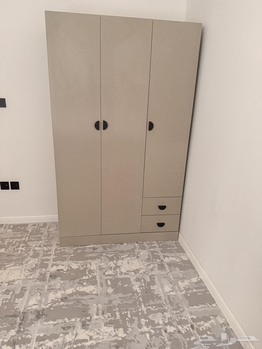 Children's bedroom with two beds, wardrobe, and drawer unit64591912676097112