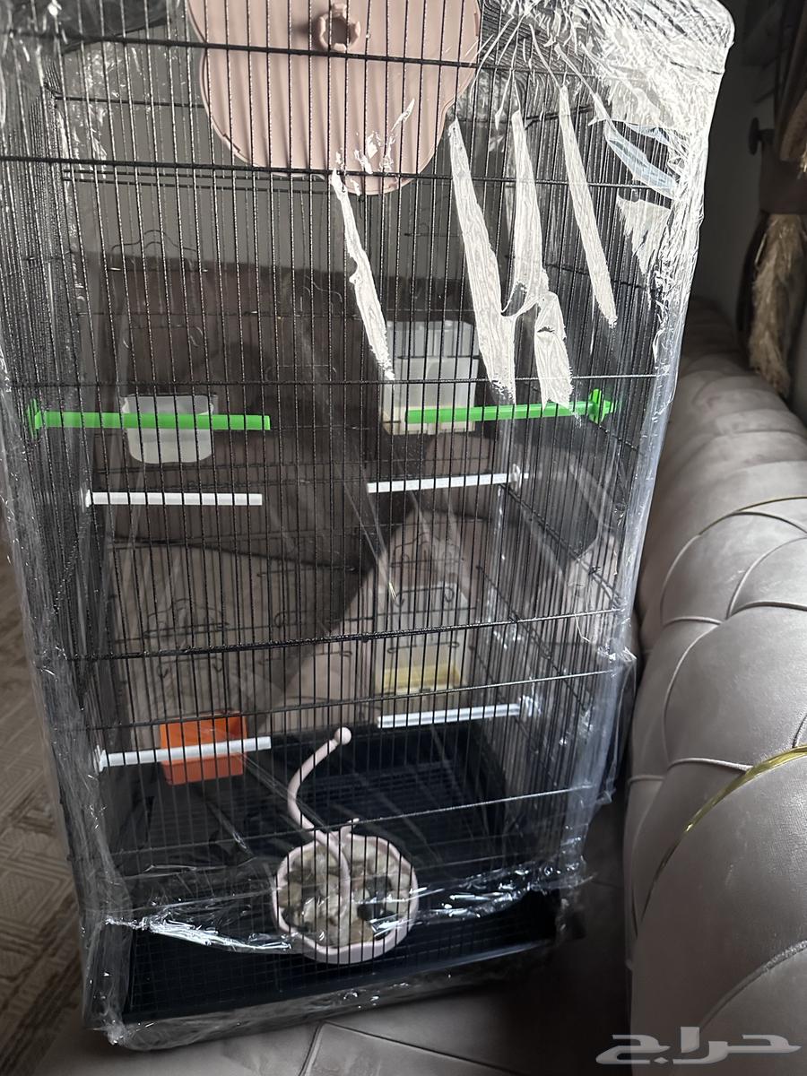 Presenting a large bird cage, lightly used, clean and new, now for sale64575098627329114
