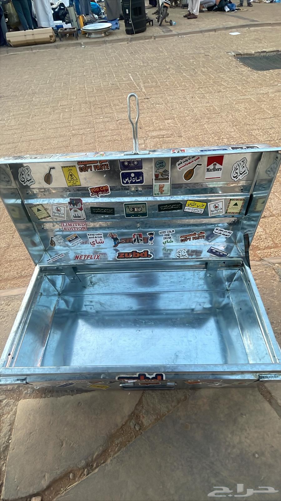 An old metal box with stickers on it64616852717699111
