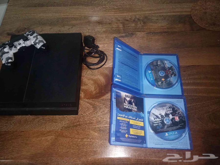 PlayStation 4 with controller and two games64579325292803112