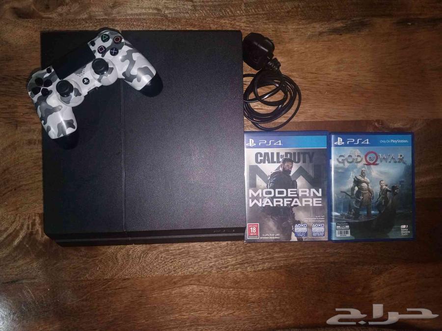 PlayStation 4 with controller and two games64579325292803110