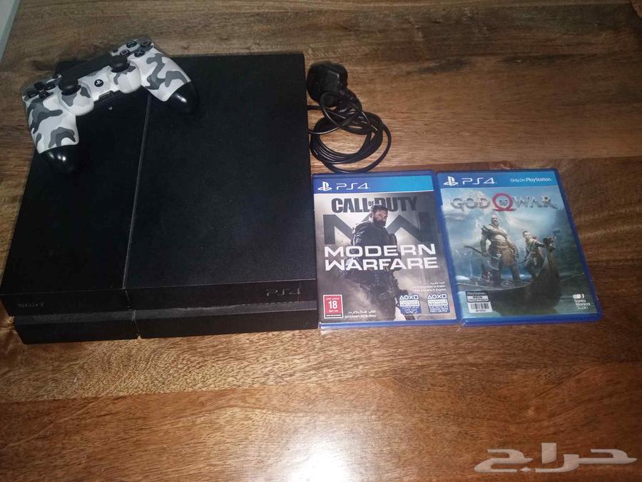 PlayStation 4 with controller and two games64579325292803111