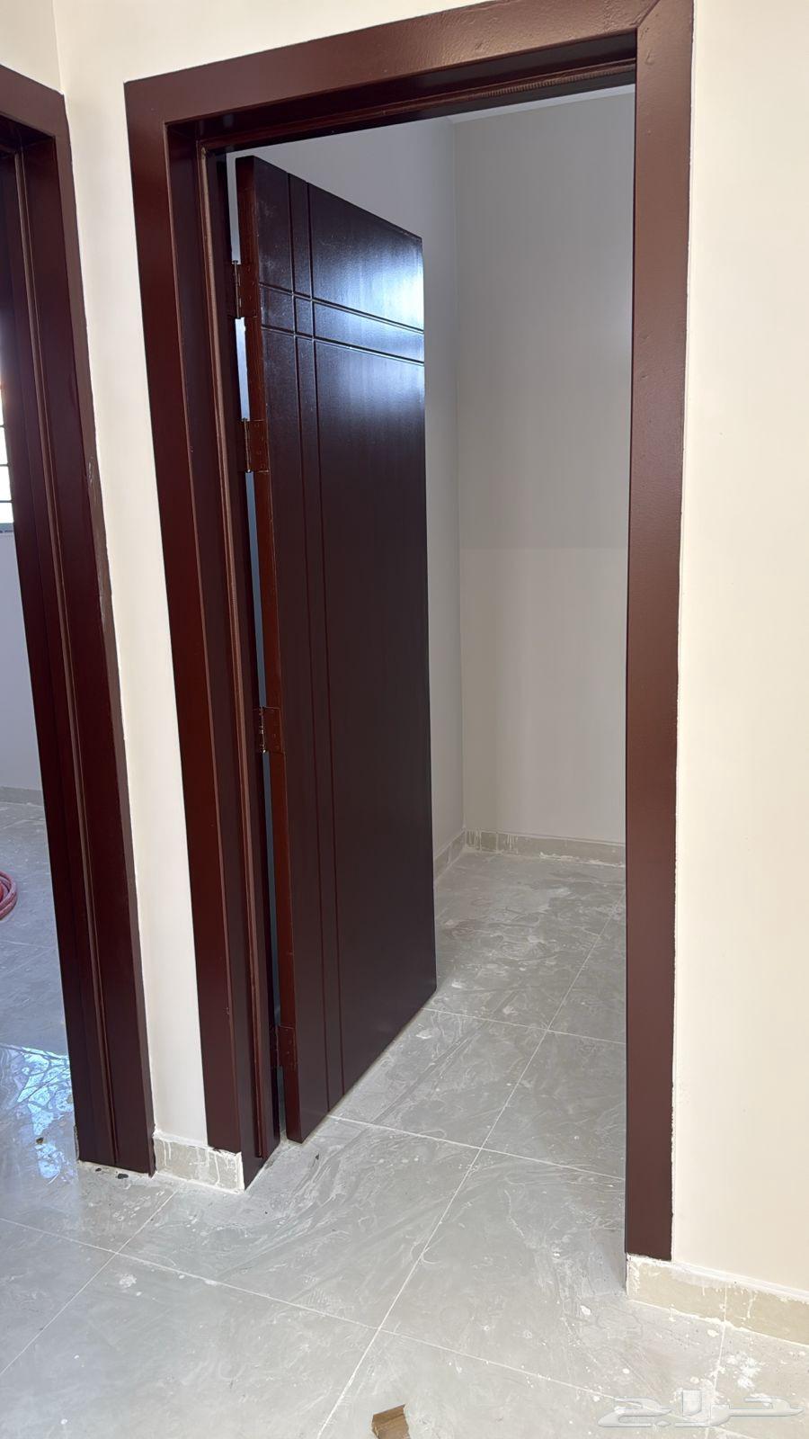 Carpenter wood doors but with shiny walnut in the middle of the water clean work64458039267586111