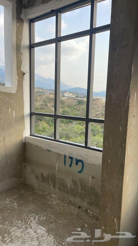 Tilted Glass Shop in Aseer with Balcony and Structure64481433734273112