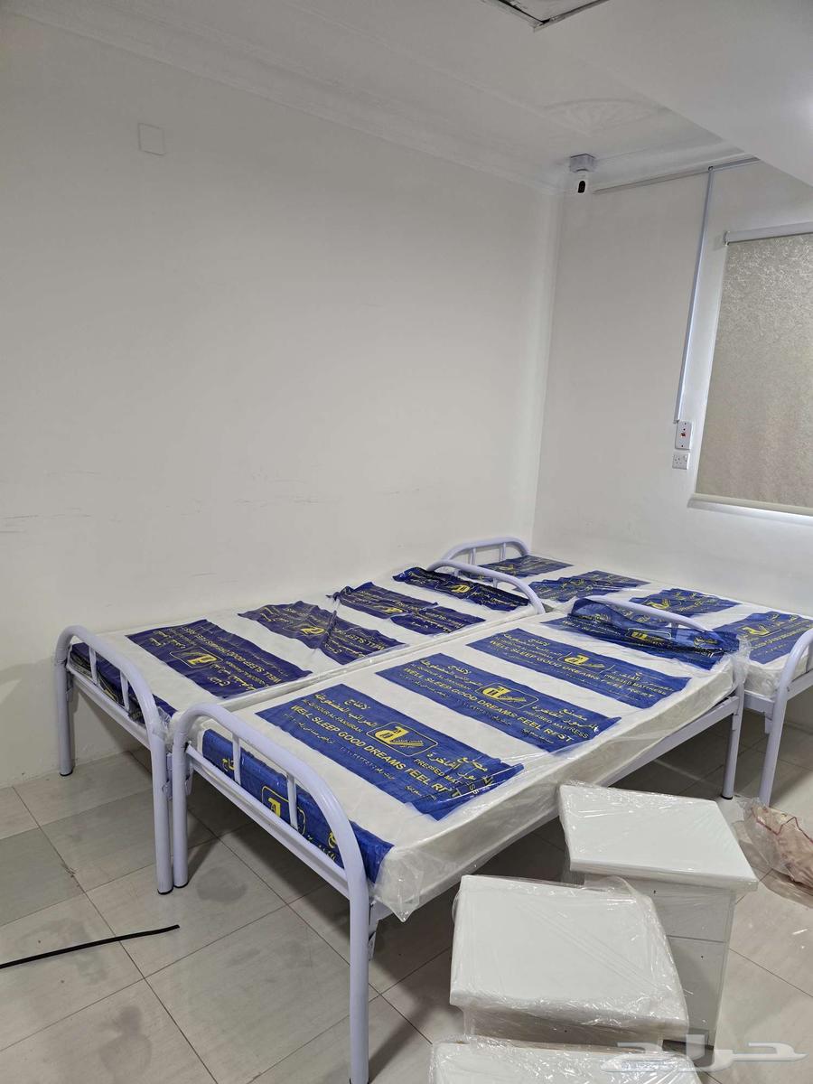 Preparing accommodation for workers: iron bed, iron wardrobe, mattresses, blankets, and pillow64589614533634114