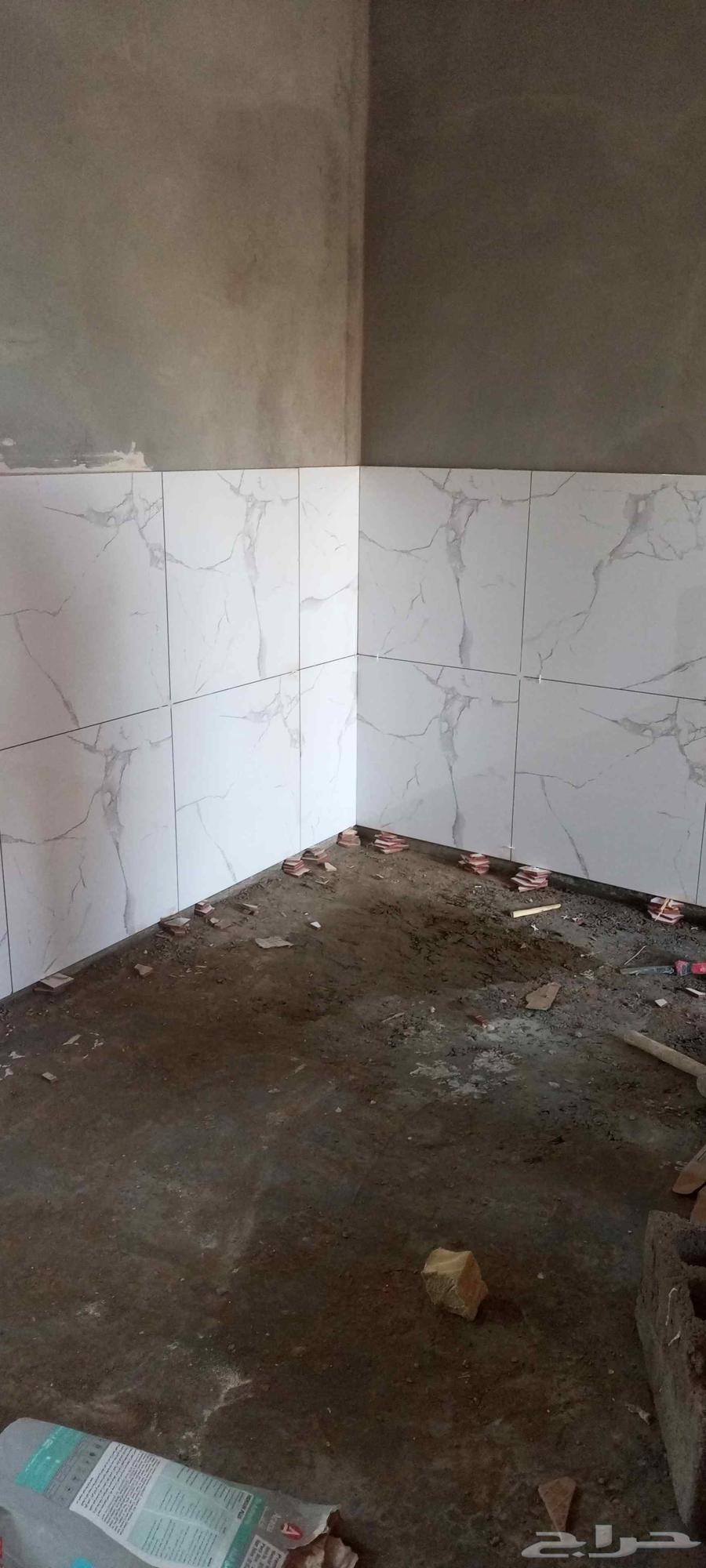 Skilled tile setter, ceramic, marble, and tile installation job well done64354908691715110