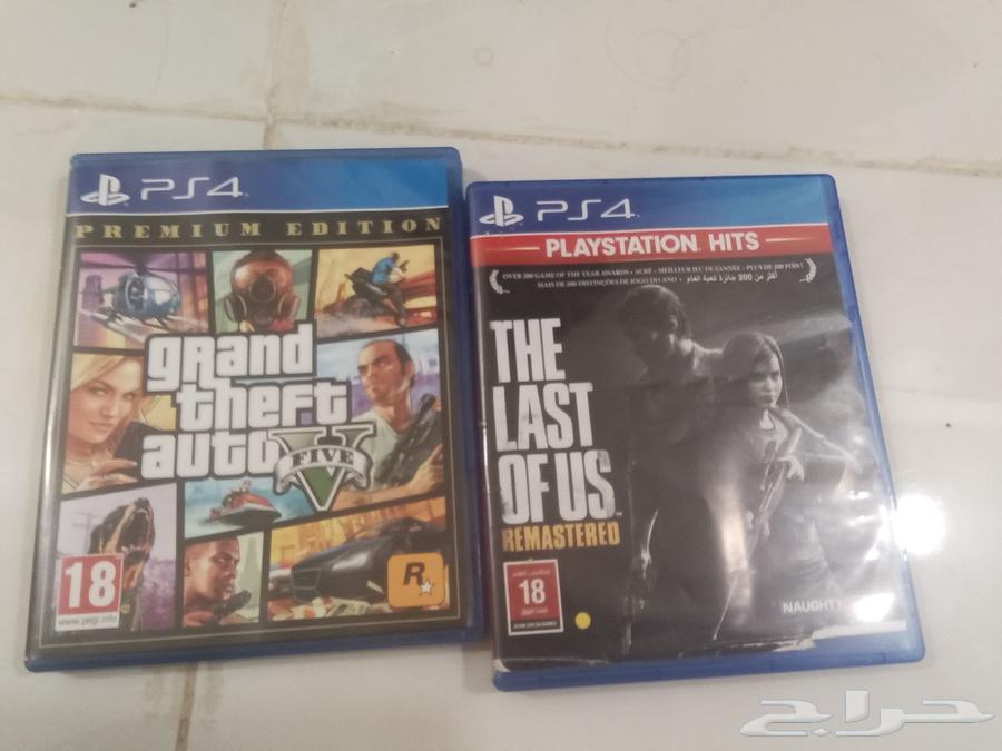 PlayStation 4 with controller and two game CDs63191841706626112