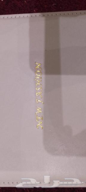 A set consisting of a watch, pen, tie clip, and prayer beads63174534287235114