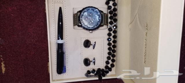 A set consisting of a watch, pen, tie clip, and prayer beads63174534287235113