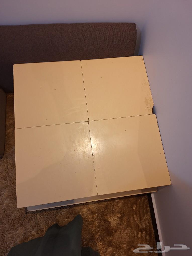 A large floor table with 4 small serving tables63174060452867113