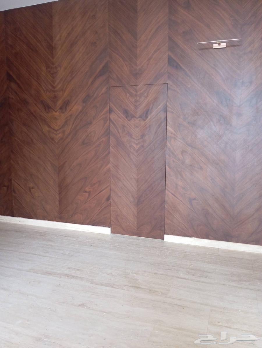 A wooden door made of walnut bark with paint and installation without handle and keyhole63065597365123112