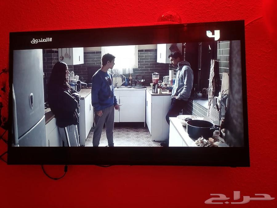 The TV screen is on, but there's nothing visible; it's 50 inches in size.63012232471681111
