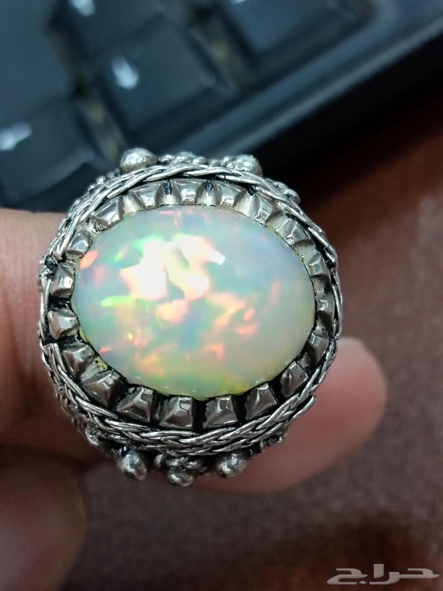 Ethiopian white opal ring with full fire in a unique wire setting634055635082251123