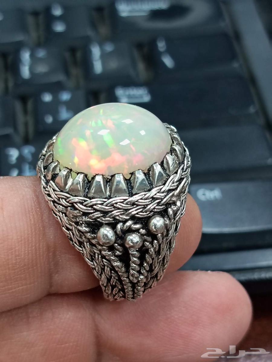 Ethiopian white opal ring with full fire in a unique wire setting63405563508225112