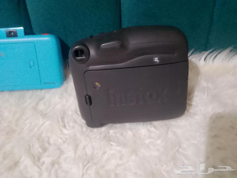 Two instant cameras63655890125441114