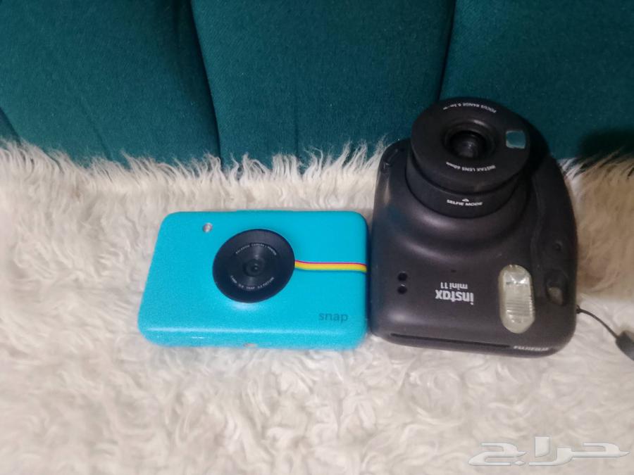 Two instant cameras63655890125441110