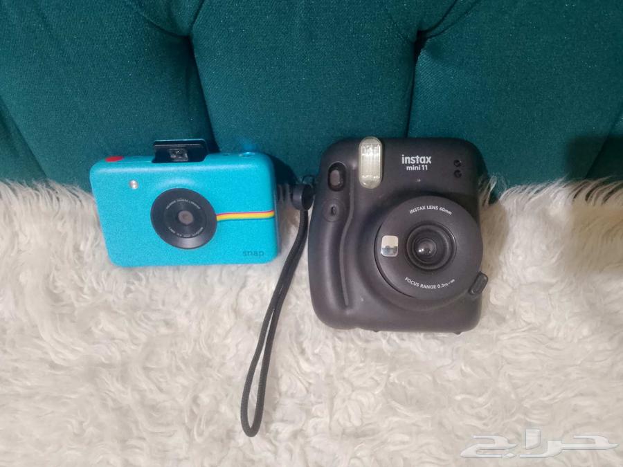 Two instant cameras63655890125441111