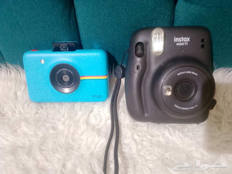 Two instant cameras63655890125441112