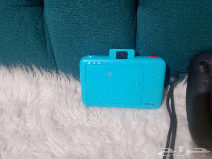 Two instant cameras63655890125441113